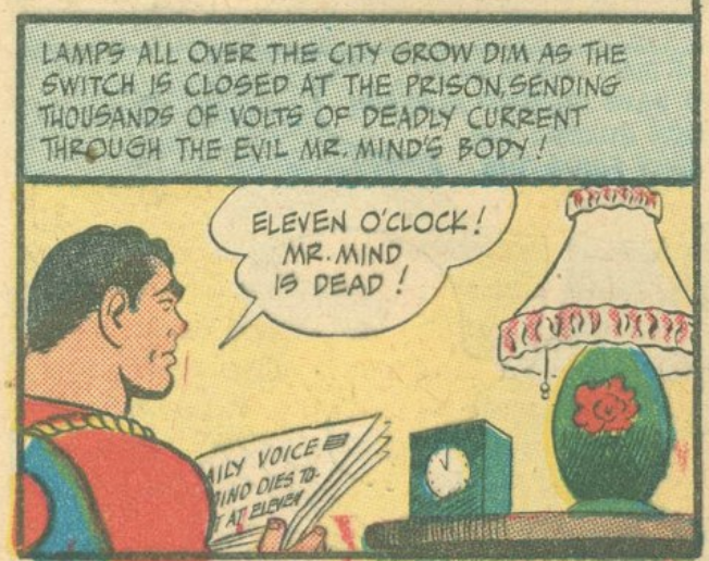 Shazam sitting by a lamp, reading a paper. The narrator says: "LAMPS ALL OVER THE CITY GROW DIM AS THE SWITCH IS CLOSED AT THE PRISON SENDING THOUSANDS OF VOLTS OF DEADLY CURRENT TROUGH THE EVIL MR. MiND'S BODY!" and Shazam says: "ELEVEN O'CLOCK! MR. MIND IS DEAD!"