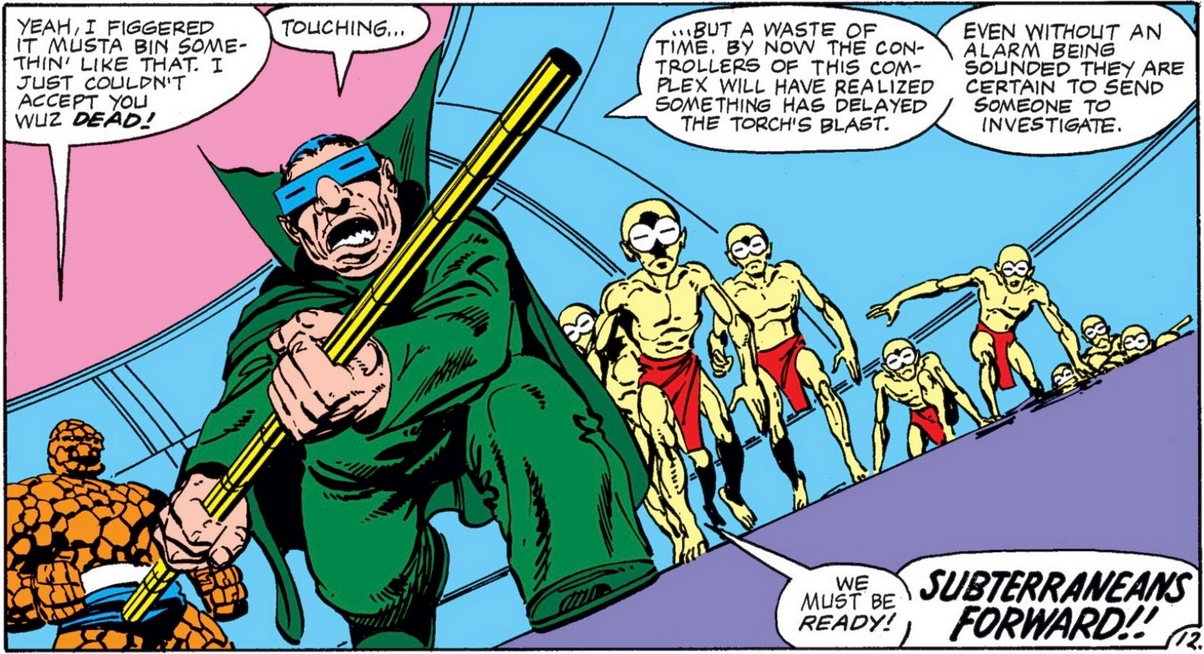 The Mole Man wearing solar eclipse glasses with a horde of pale humanoids behind him. All of them are wearing red loin cloths for some reason.